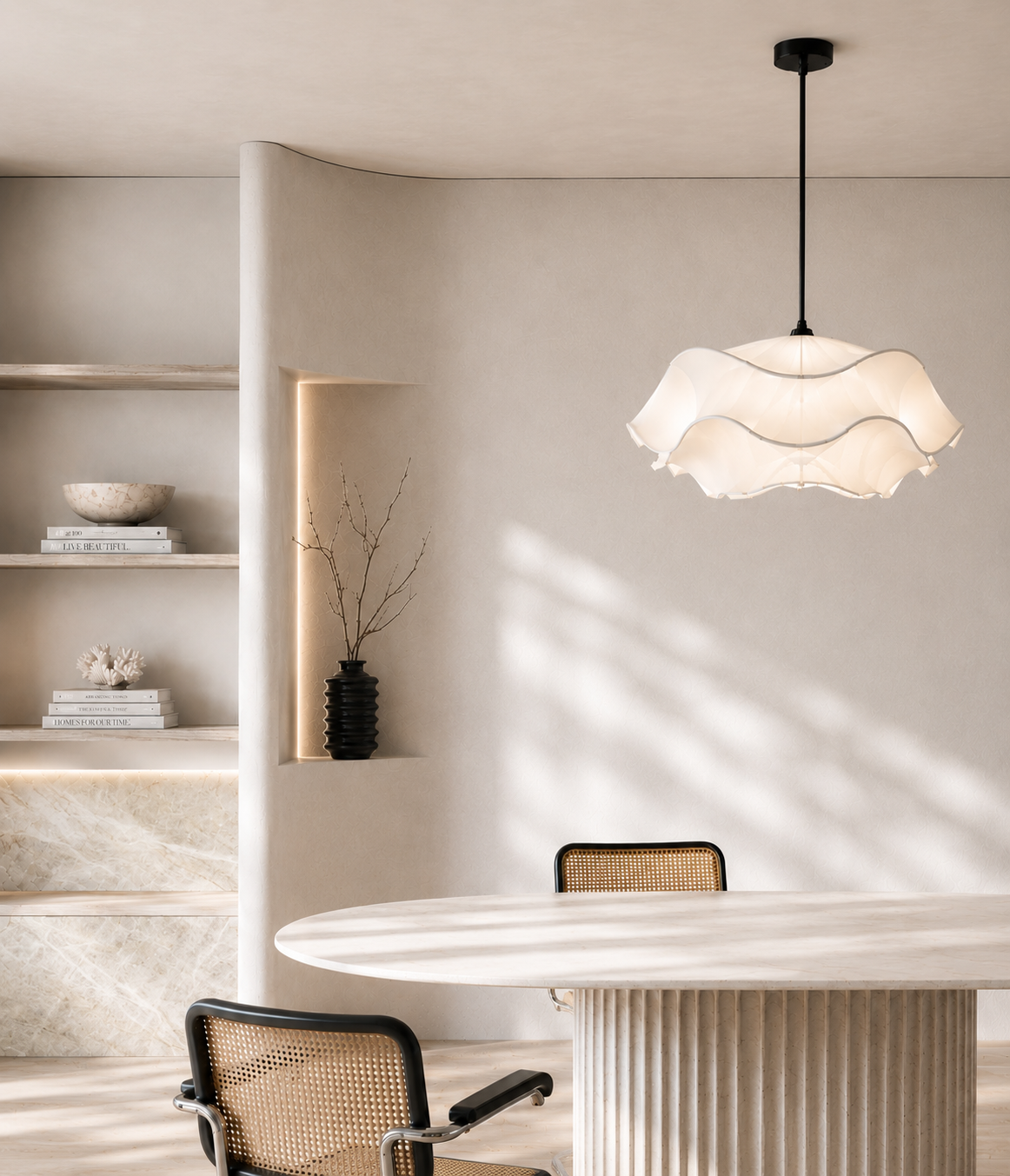 Warm neutral dining interior with sculptural pendant, stone table and layered material palette by Mike and Morlly Architects + Interiors